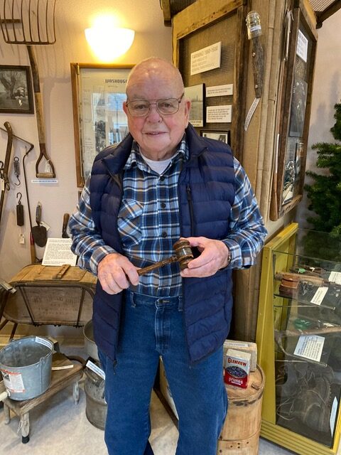 Jim Cobb holding a 1940s gavel